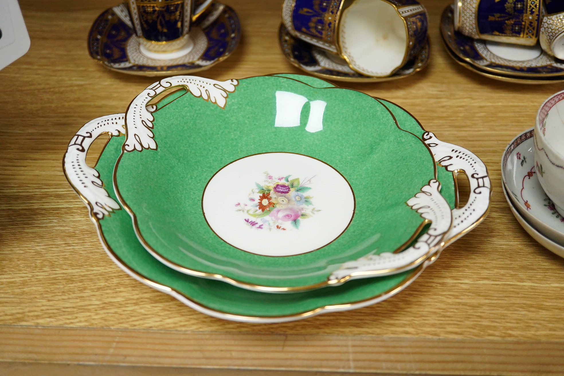 A collection of Coalport porcelain to include cups and saucers, a Meissen Pony, Meissen blue and white plate and a 19th century desk stand, largest 25cm wide